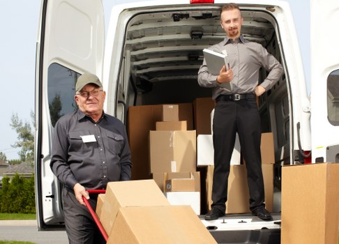 Man with van service helping with a Soho move on a busy central London street