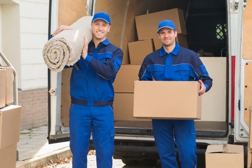 Removal van and moving team in Soho street setting