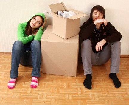 Removal team handling furniture in a central London apartment