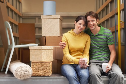 Careful furniture handling in a flat move near Soho's residential blocks