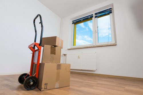 Packed moving boxes and furniture ready for a Soho removal