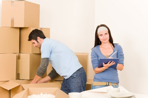 Moving team handling furniture carefully for a Soho relocation