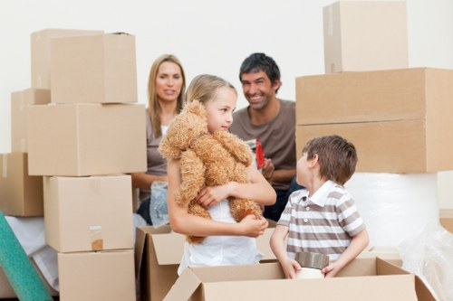Professional movers carrying furniture in central London